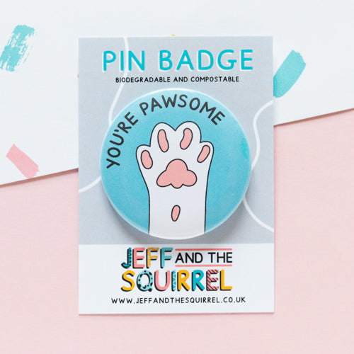 Punny biodegradable badge with a paw illustration. Badge reads You're Pawsome